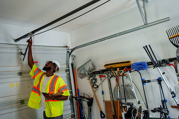 Professional Garage Door Spring Repair technician working in East Douglas, MA